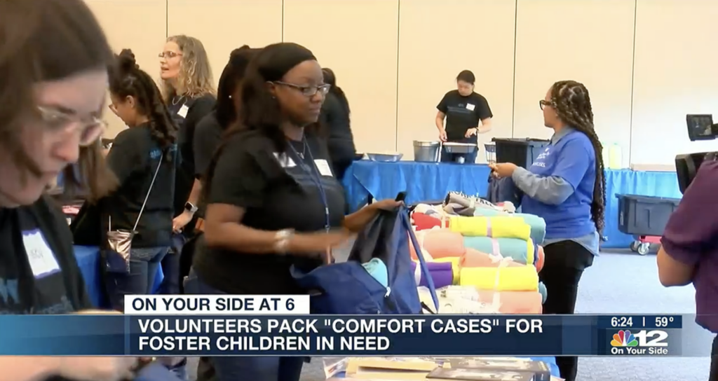 Volunteers pack “Comfort Cases” for foster children in need