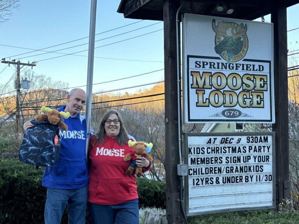 Dan Companion and Jessica Corliss hold two of 1,000 Tommy Moose Bears that will go into ‘comfort cases’ for children with family displacement in foster care.